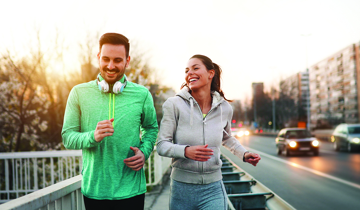 man_and_woman_jogging_outdoors_in_city